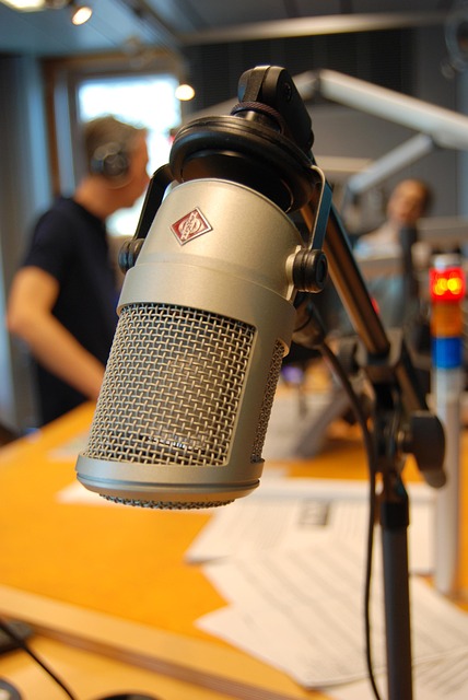 Microphone on a stand, representing broadcast journalism.